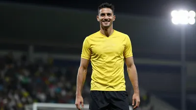 A 35-year-old, 185cm-tall, athletic-looking, dark-haired, clean-shaven, smiling, focused, left-footed, central defender...