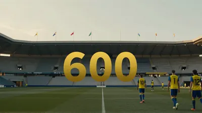 A bustling Estadio Gran Canaria under late afternoon sun, thousands of fans in blue and yellow scarves filling the...