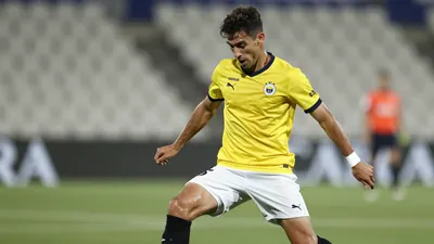A photorealistic image of a 28-30-year-old UD Las Palmas central defender in a yellow jersey with white shorts and black...