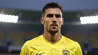 Photorealistic head-and-shoulders of a 30s male midfielder in a solid yellow jersey, blurred stadium background